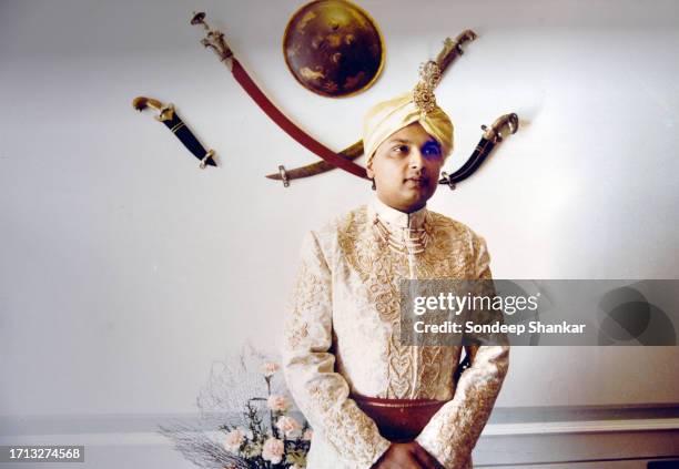 Anil Ambani, the younger son of Indian business tycoon Dhirubhai Ambani who founded Reliance Industries poses for a photograph after he is dressed...