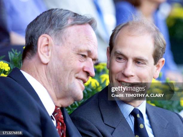 Britain's Prince Edward talks with Canadian Prime Minister Jean Chretien at the Commonwealth Stadium during the opening ceremonies of the eighth...