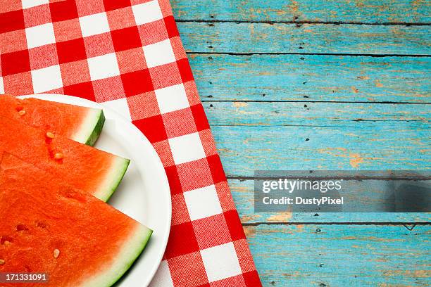 summer picnic concept with watermelon and checkered napkin - empty picnic table stock pictures, royalty-free photos & images