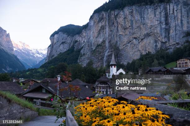 the picturesque town of lauterbrunnen - staubbach falls stock pictures, royalty-free photos & images