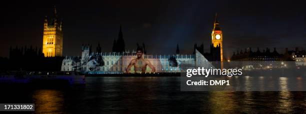 olympic swimmer mark spitz projected onto the houses of parliament - mark spitz pictures stock pictures, royalty-free photos & images