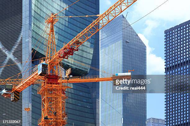 skyscrapers and construction site in guangzhou - construction crane asia stock pictures, royalty-free photos & images
