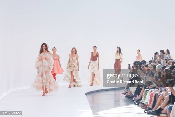Models walk the runway during the Zimmermann Womenswear Spring/Summer 2024 show at palais de Tokyo as part of Paris Fashion Week on October 02, 2023...