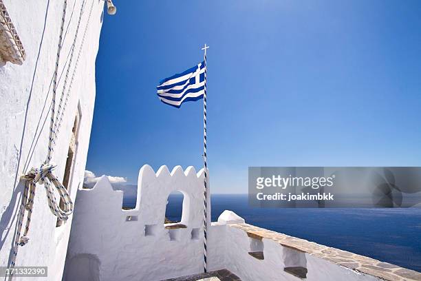 greek flag waving in the sky - greek flag stockfoto's en -beelden