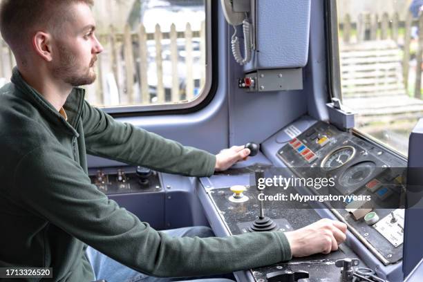 train driver on a commuter train - machinist stockfoto's en -beelden