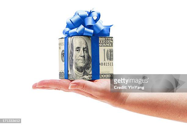hand holding money cash gift with blue bow on white - wrapping arm stock pictures, royalty-free photos & images