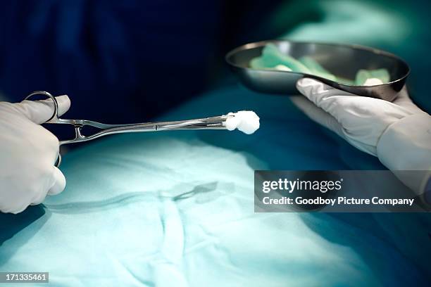 on the operating table - cleaning sponge stock pictures, royalty-free photos & images
