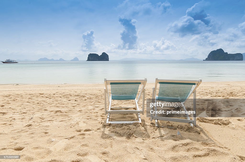 Beach chairs on perfect tropical white sand