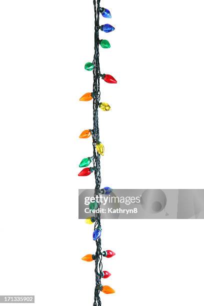 string of christmas lights - kerstverlichting stockfoto's en -beelden