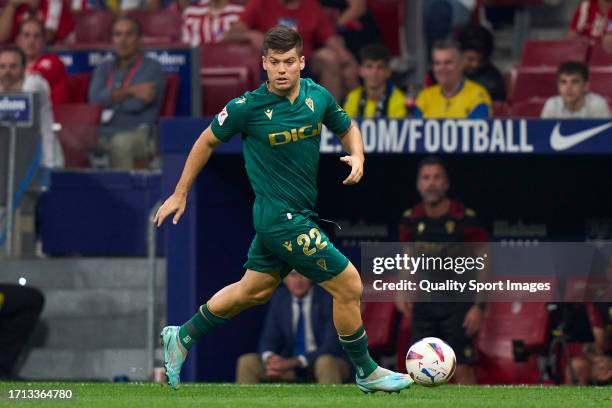 Jorge Mere of Cadiz CF runs with the ball during the LaLiga EA Sports match between Atletico Madrid and Cadiz CF at Civitas Metropolitano Stadium on...