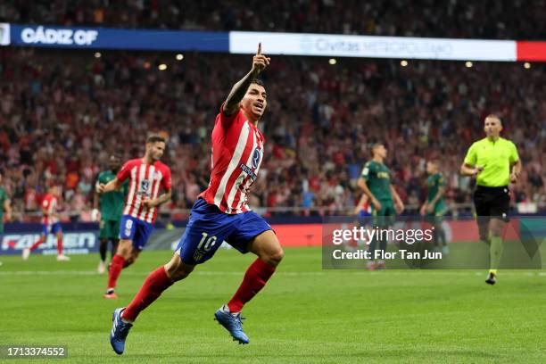 Angel Correa of Atletico de Madrid celebrates after scoring the team's fir goal during the LaLiga EA Sports match between Atletico Madrid and Cadiz...