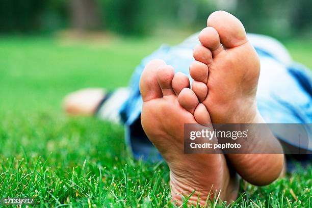 relaxation - barefoot grass stock pictures, royalty-free photos & images