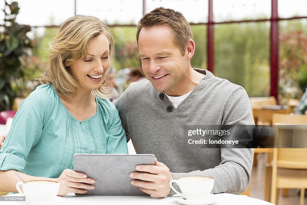 Couple Looking At Digital Tablet