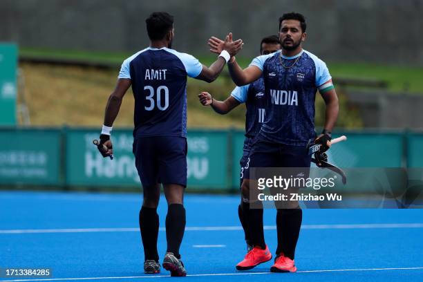Harmanpreet Singh of India celebrates his goal during The 19th Asian Games, Hockey Preliminary Men's Pool A between India and Bangladesh at Gongshu...