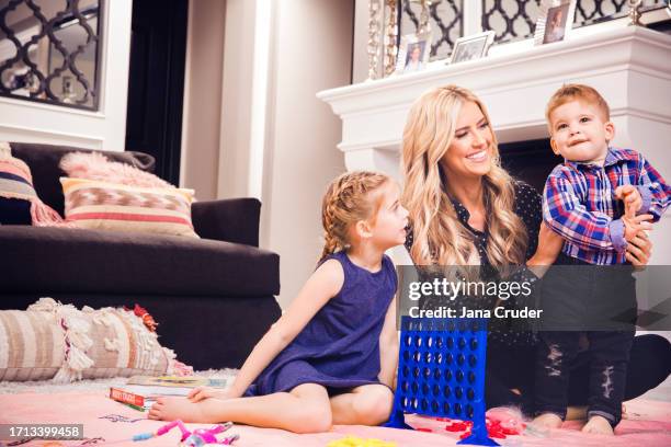 Personality Christina El Moussa is photographed with children Taylor and Brayden for People Magazine on February 13, 2017 in Yorba Linda, California....