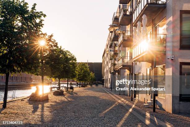 street in copenhagen on a sunny summer day, denmark - copenhagen harbour stock pictures, royalty-free photos & images