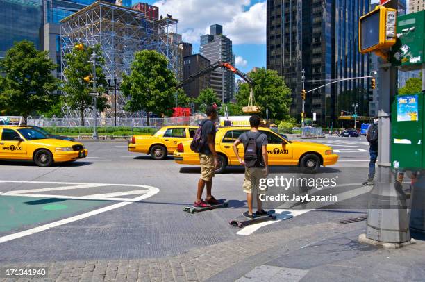 nyc intersections, skateboarders at broadway,columbus circle manhattan - security camera view stock pictures, royalty-free photos & images