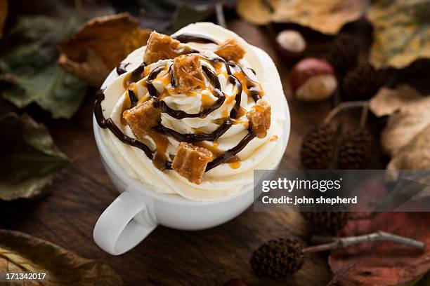 hot drink with cream, caramel waffle pieces and chocolate sauce - chocolate sauce stock pictures, royalty-free photos & images