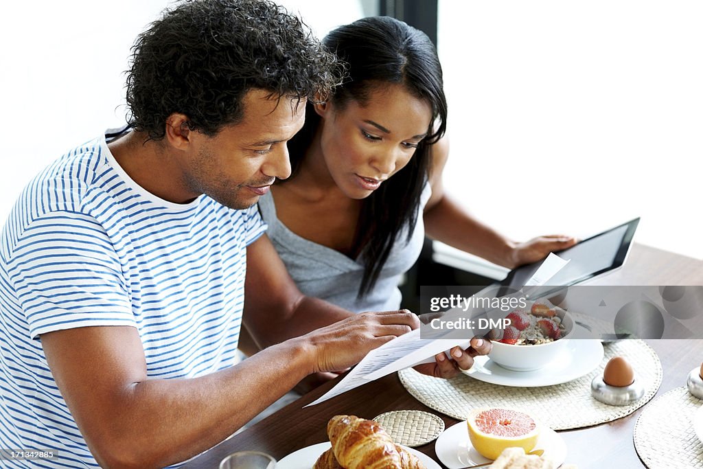 Couple calculating their home expenses