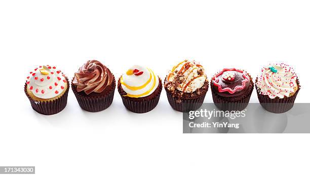 fancy gourmet cupcakes, dessert temptations in row on white backround - cake isolated stock pictures, royalty-free photos & images