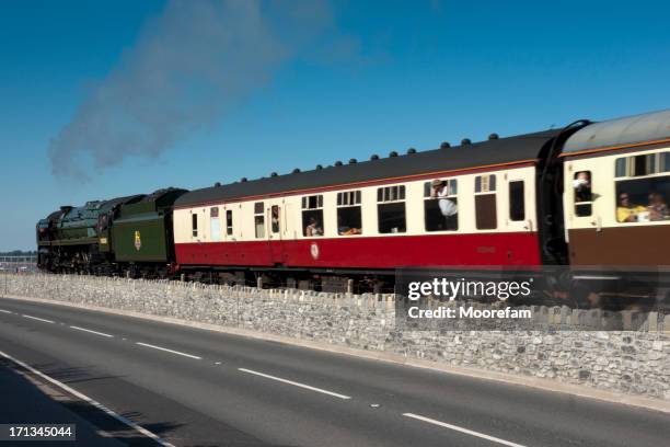 torbay express steam train pulling tourist carriages though starcross devon - starcross stock pictures, royalty-free photos & images