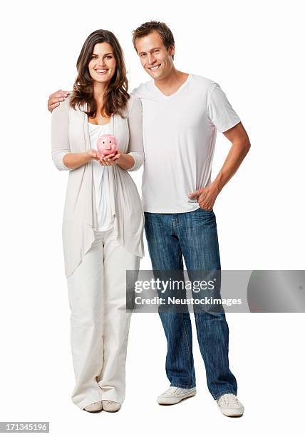 couple holding a piggy bank - isolated - couple saving piggy bank stock pictures, royalty-free photos & images
