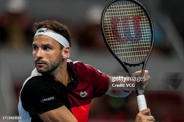 Grigor Dimitrov of Bulgaria returns a shot in the Men's Singles Quarter-final match against Jannik Sinner of Italy on day seven of 2023 China Open at...