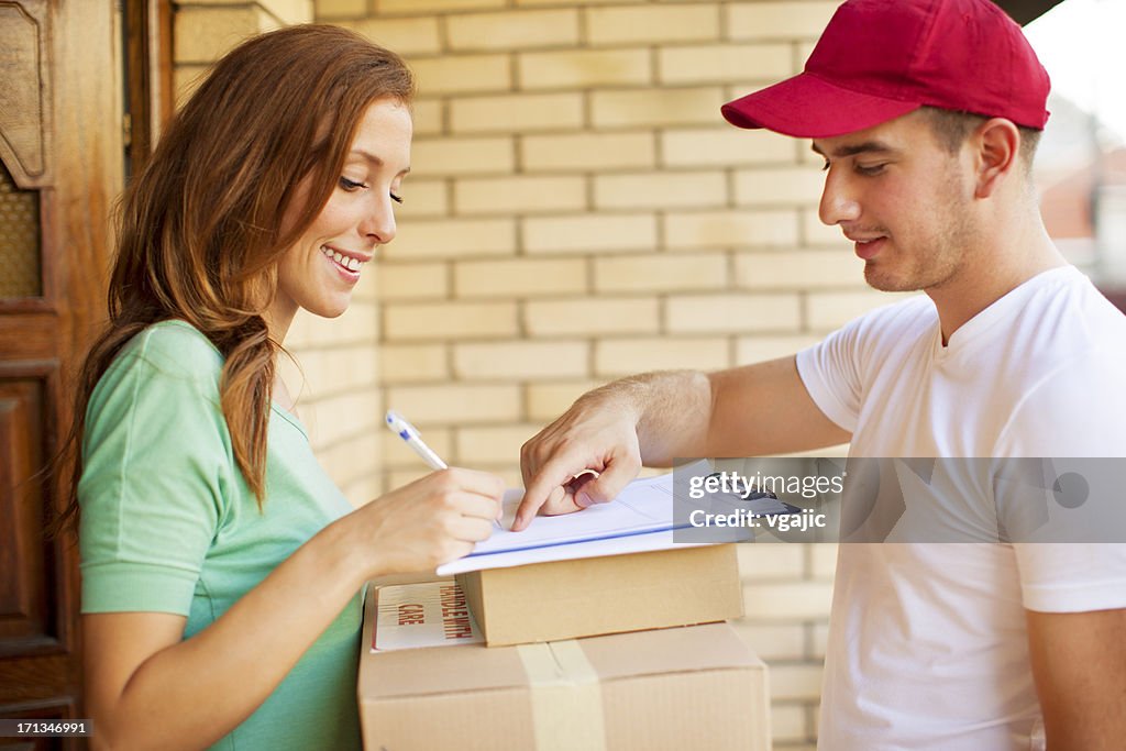 Delivery Others Delivery Person With Packages High-Res Stock Photo - Getty Images