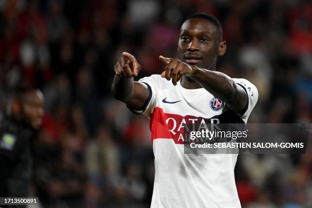 Paris Saint-Germain's French forward Randal Kolo Muani celebrates after scoring a goal during the French L1 football match between Rennes and Paris...