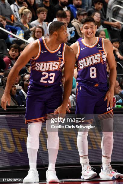Eric Gordon and Grayson Allen of the Phoenix Suns look on during the game against the Detroit Pistons on October 8, 2023 at Little Caesars Arena in...