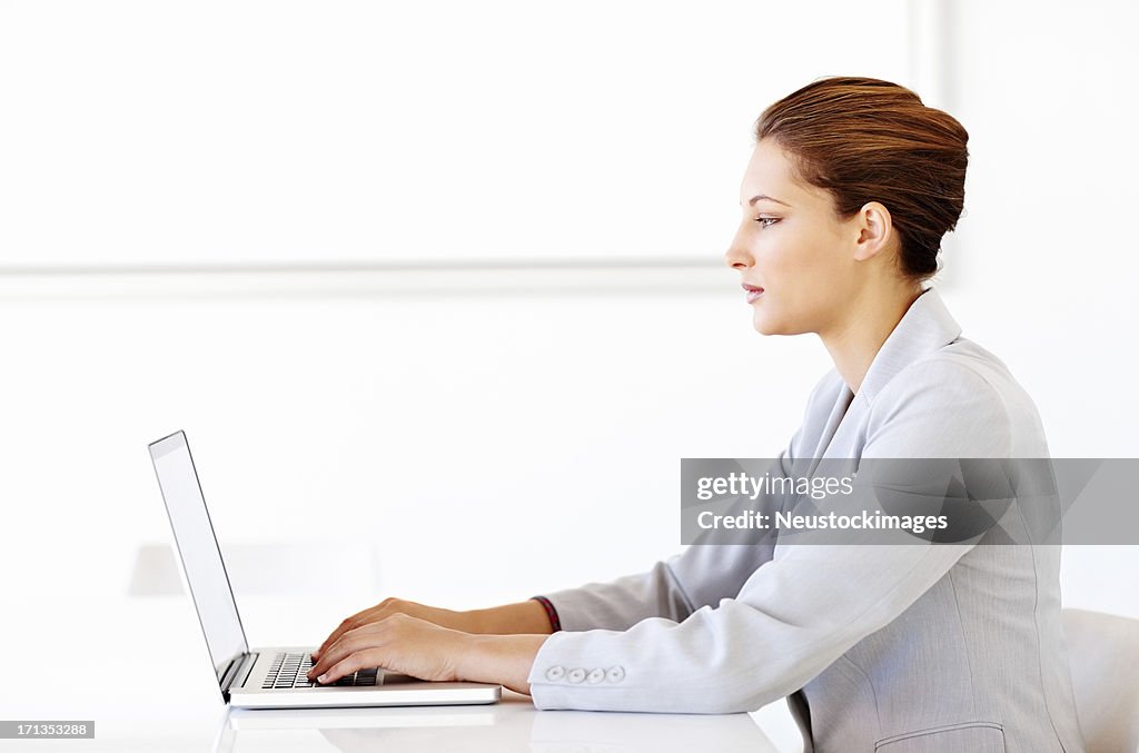 Female Executive Working On Laptop