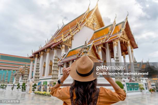 torist woman at wat suthat, bangkok, thailand. - vlogging stock pictures, royalty-free photos & images