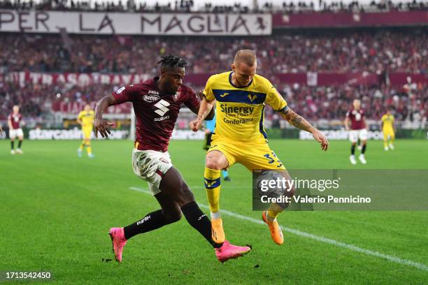 Duvan Zapata of Torino is tackled by Ondrej Duda of Hellas Verona during the Serie A TIM match between Torino FC and Hellas Verona FC at Stadio...