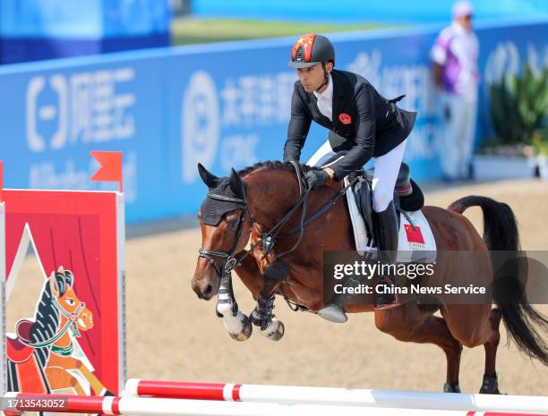 Hua Tian of Team China competes in the Equestrian - Eventing Jumping Team Final & Ind Final on day nine of the 19th Asian Games at Tonglu Equestrian...