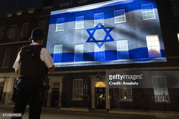 Israeli flag is projected onto the front facade of Prime Minister's Office, also known as the 10 Downing Street, in London, United Kingdom on October...