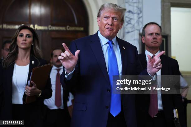 Former U.S. President Donald Trump speaks to the media after exiting the courtroom for a lunch recess during the first day of his civil fraud trial...