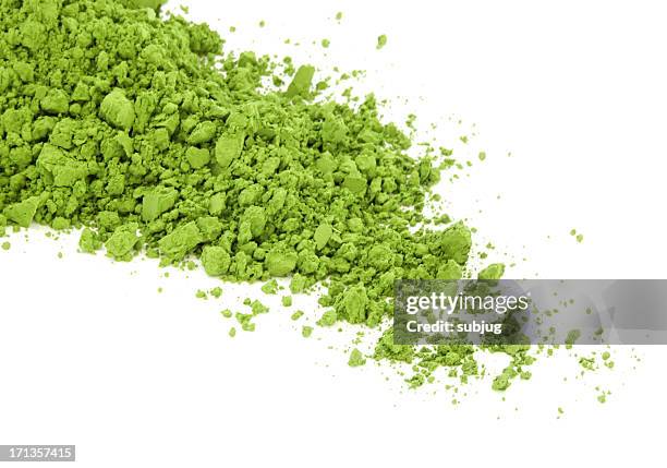 matcha green tea spilt over the white surface - matcha stockfoto's en -beelden