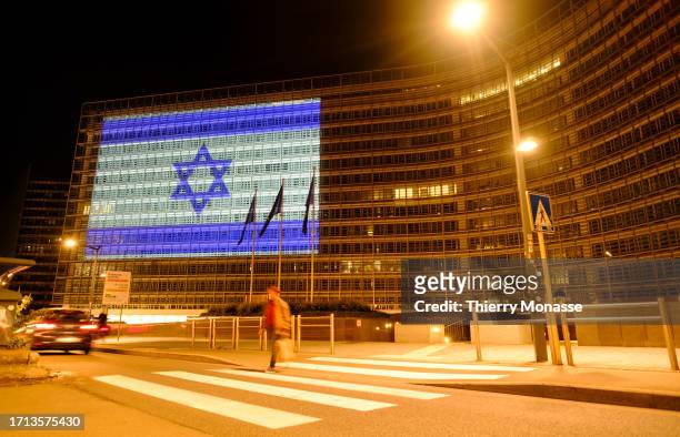 The Israeli Flag is projected onto the Berlaymont, the EU Commission headquarters on October 8, 2023 in Brussels, Belgium. EU States and the USA...