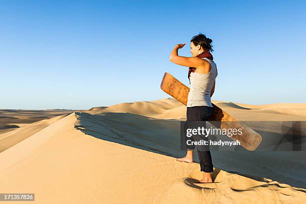 sandboarding in the sahara desert, africa - sand boarding stock pictures, royalty-free photos & images