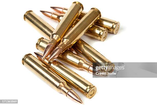 loose pile of bullets - munitie stockfoto's en -beelden