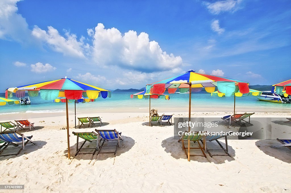 White Sandy Beach with Chairs and Umbrellas