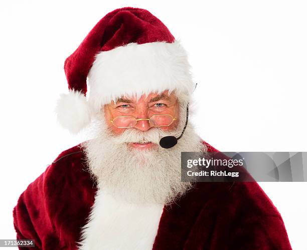 santa claus with headset - santa suit stock pictures, royalty-free photos & images