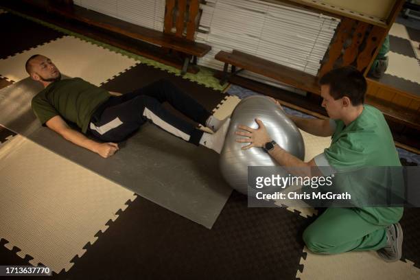 Soldier works with a physical therapist at a rehabilitation center working with soldiers suffering from injuries and psychological trauma on October...