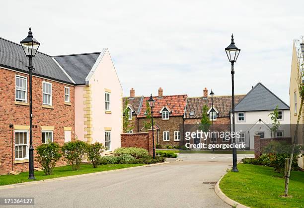 housing development in traditional english design - village stock pictures, royalty-free photos & images