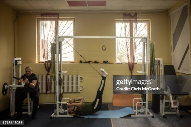 Soldiers take part in physical therap at a rehabilitation center working with soldiers suffering from injuries and psychological trauma on October...