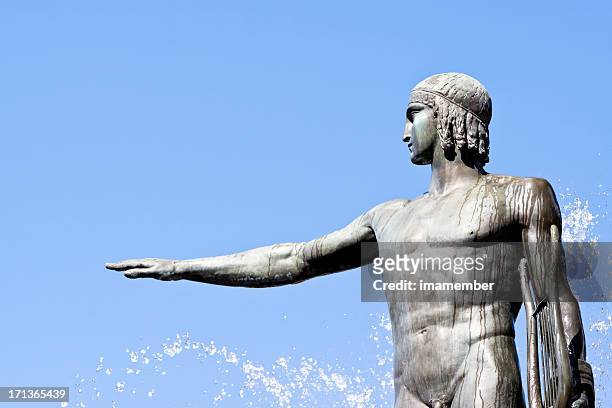 statue of apollo-god of music against blue sky, copy space - apollo stockfoto's en -beelden