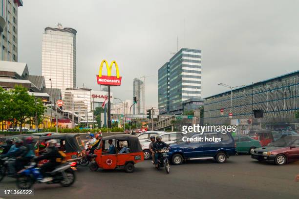 traffic in the central business district, jakarta - jakarta stock pictures, royalty-free photos & images