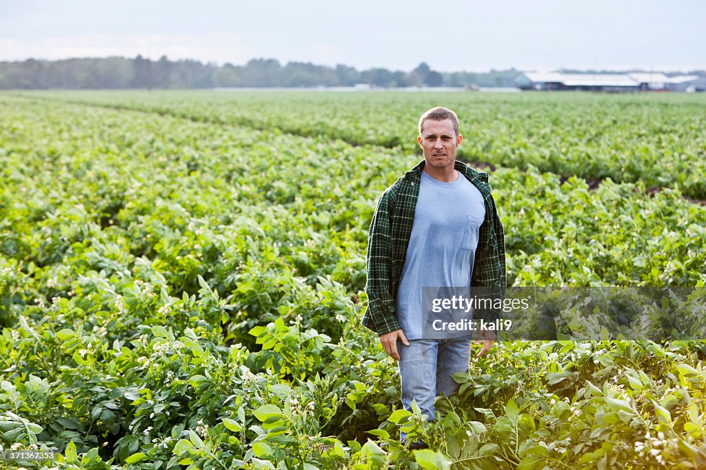 Farmer standing in field