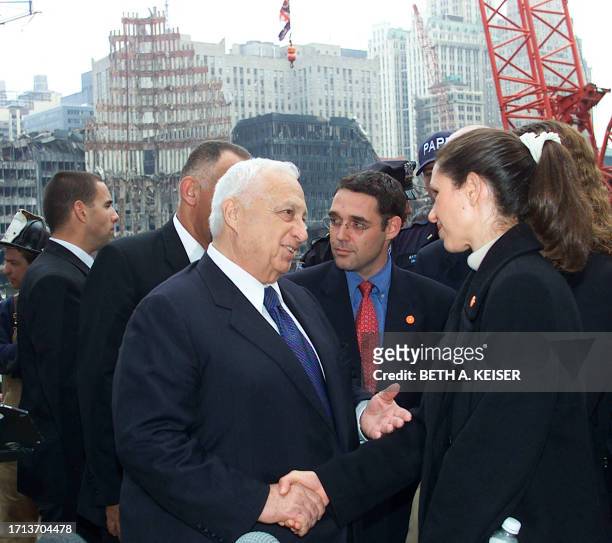 Israeli Prime Minister Ariel Sharon shares a moment with Sigal Shefi an Israeli citizen who lost her husband in the World Trade Center terrorist...