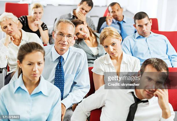 exhausted businesspeople on a seminar - bored audience stock pictures, royalty-free photos & images